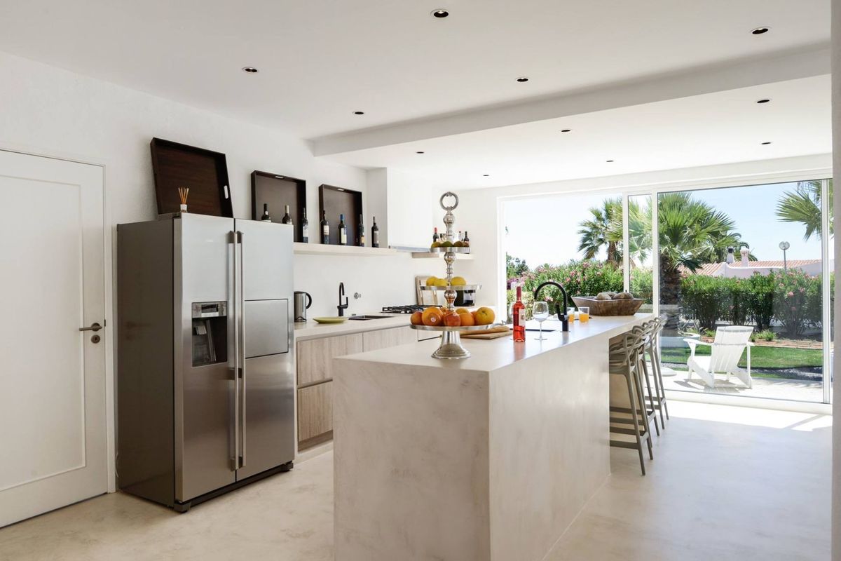 Visualisation of a light grey microcement kitchen island, seamless satin finish